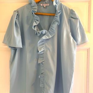 NWOT polyester ruffled blouse.  Never worn